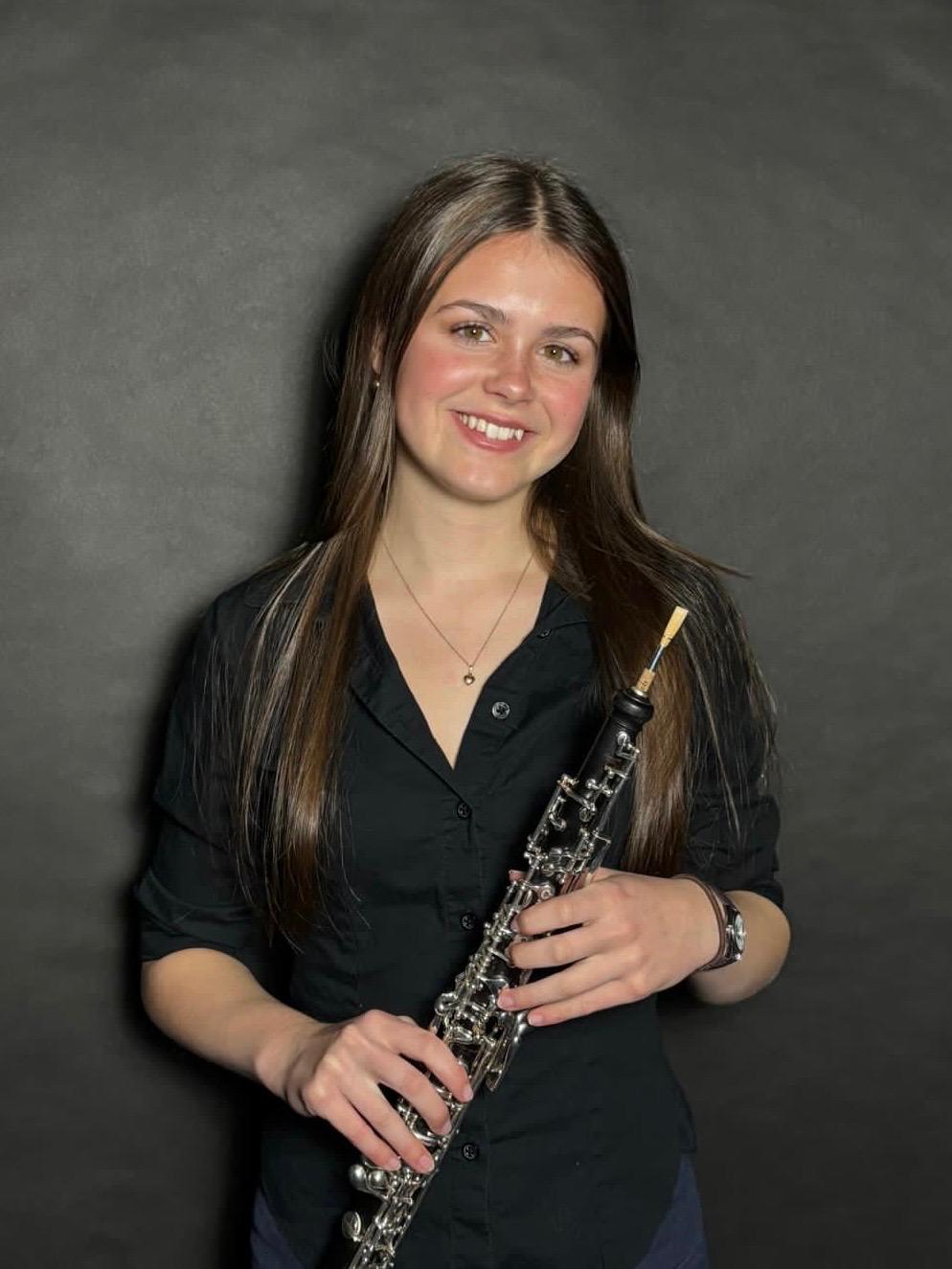 Emily Carrington holding her oboe